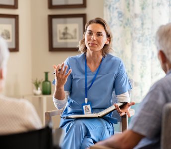 caregiver talking to elderly