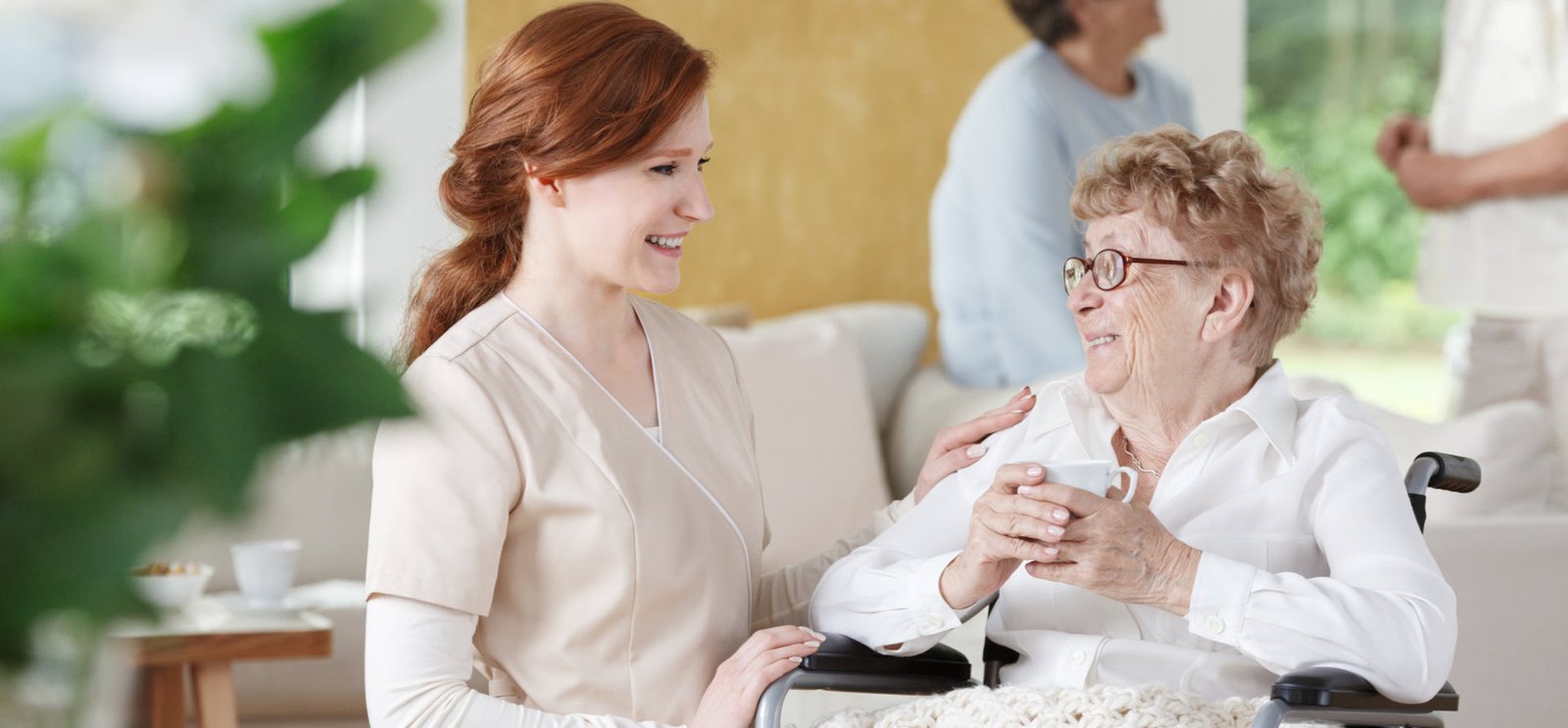 elderly and caregiver smiling