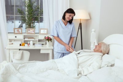 caregiver taking care of senior woman