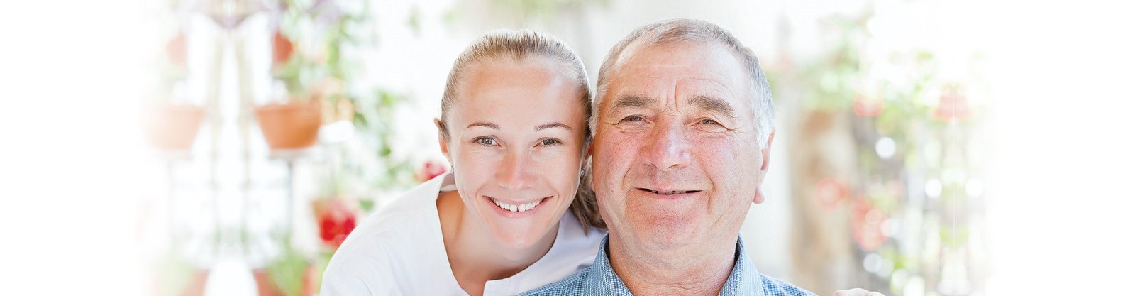 caregiver and elderly smiling