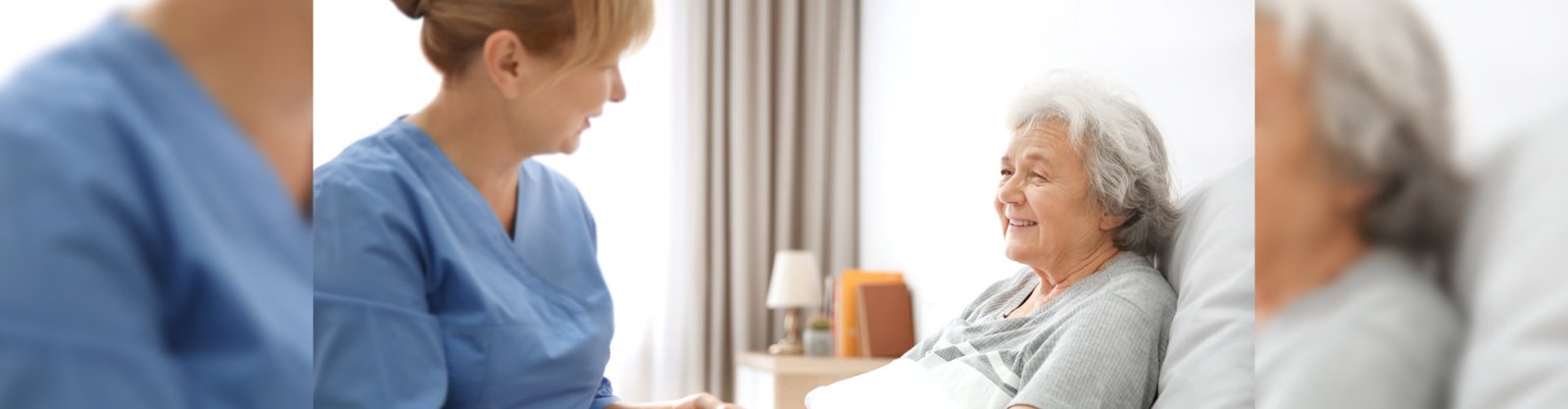 caregiver massaging hand of senior woman